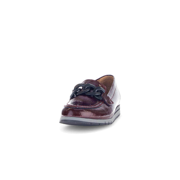 Gabor women's burgundy red and black patent leather slip-on loafers with chain detail and low heel.