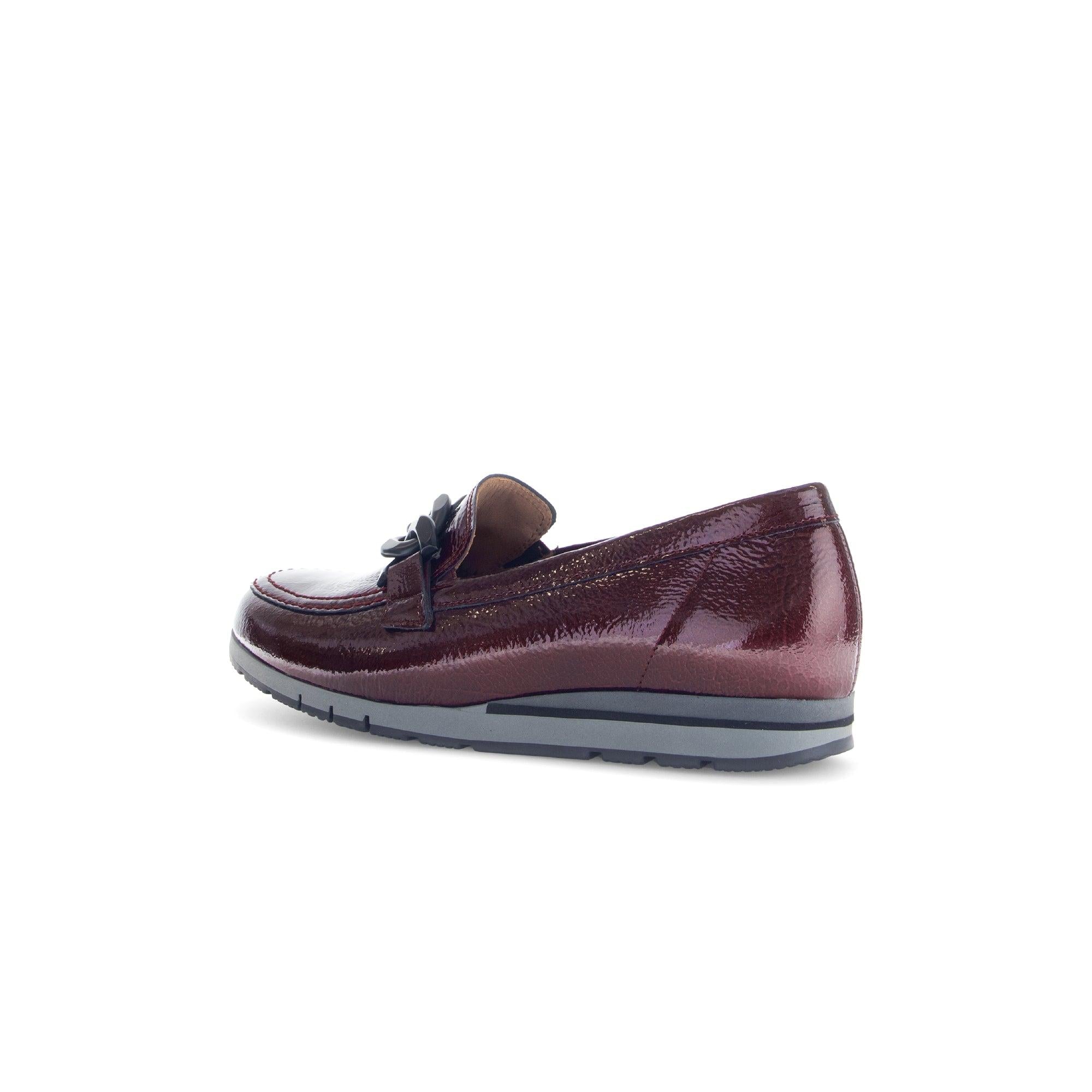 Gabor women's burgundy and black grained patent leather slip-on loafers with bow detail and cushioned sole.