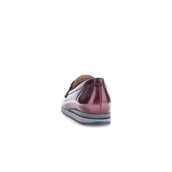 Gabor women's slip-on loafers in burgundy and black grained patent leather, with a sporty sole, back view.