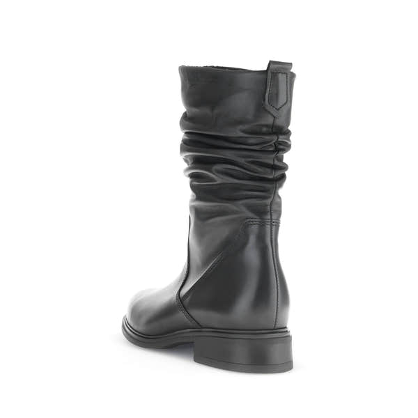 Women's black waxed leather mid-calf boots with side zipper, slouchy design, and low heel.