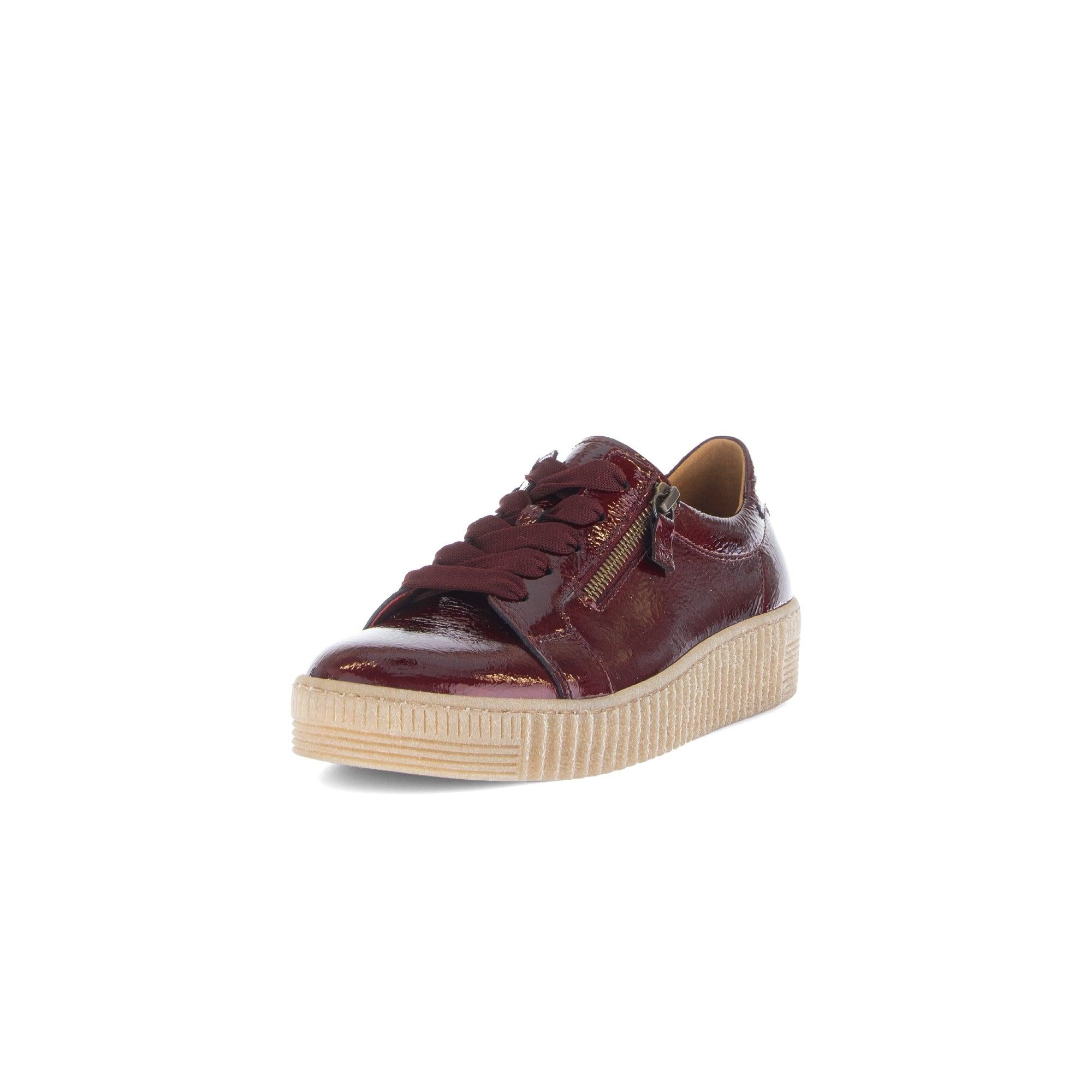 Gabor women's burgundy leather zip and lace trainer with beige platform sole and stylish gold detailing.