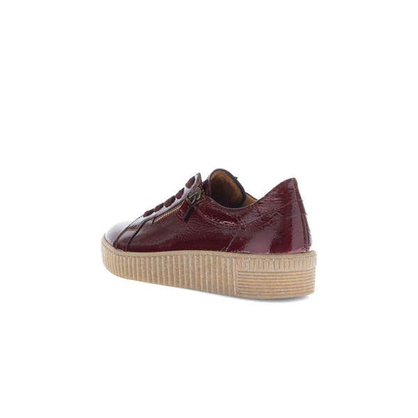 Gabor Ladies Bordo Red Leather Trainers with lace-up front, side zip, and chunky beige sole.