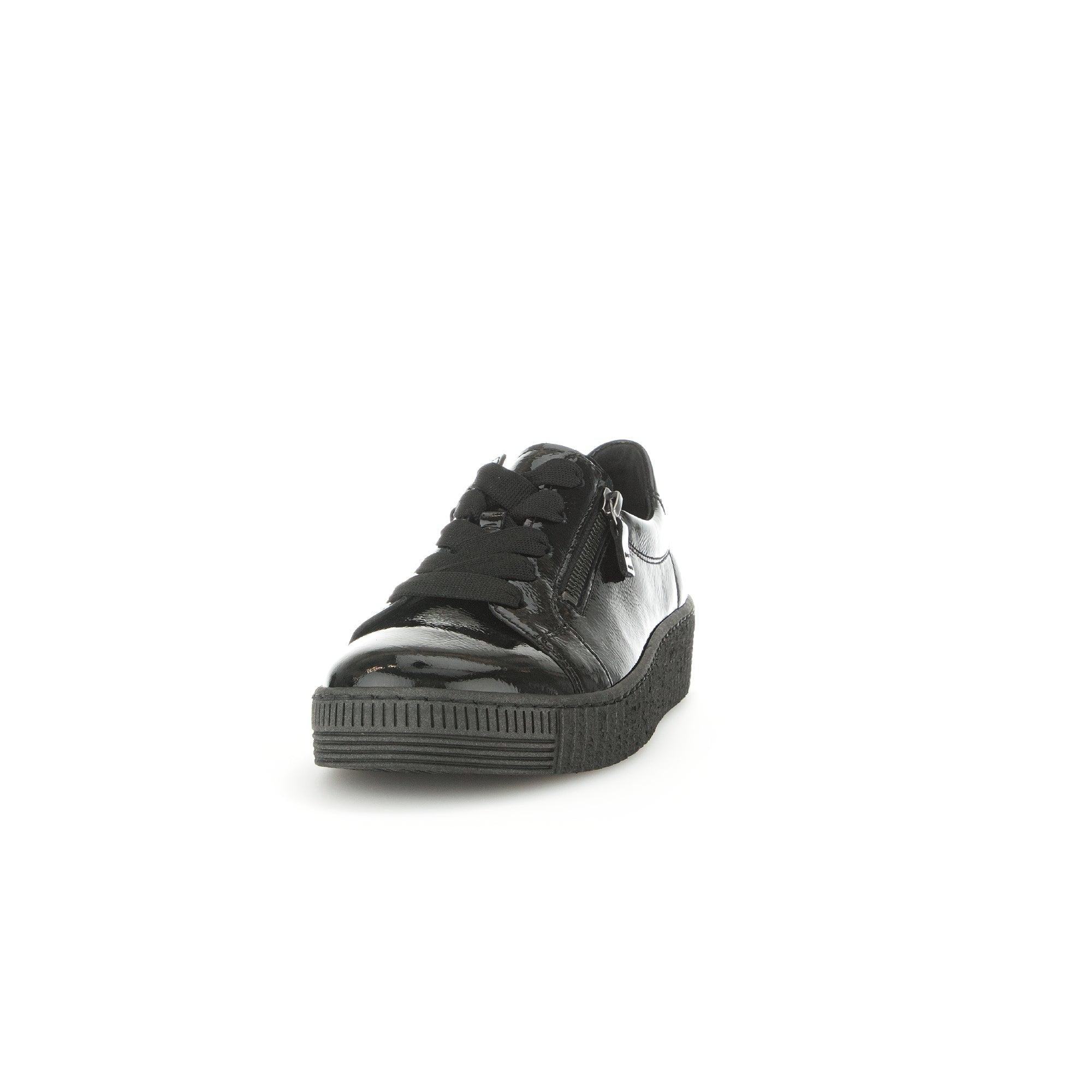 Gabor Ladies' black patent leather trainers with zip and lace-up design, chunky sole, and stylish casual look.