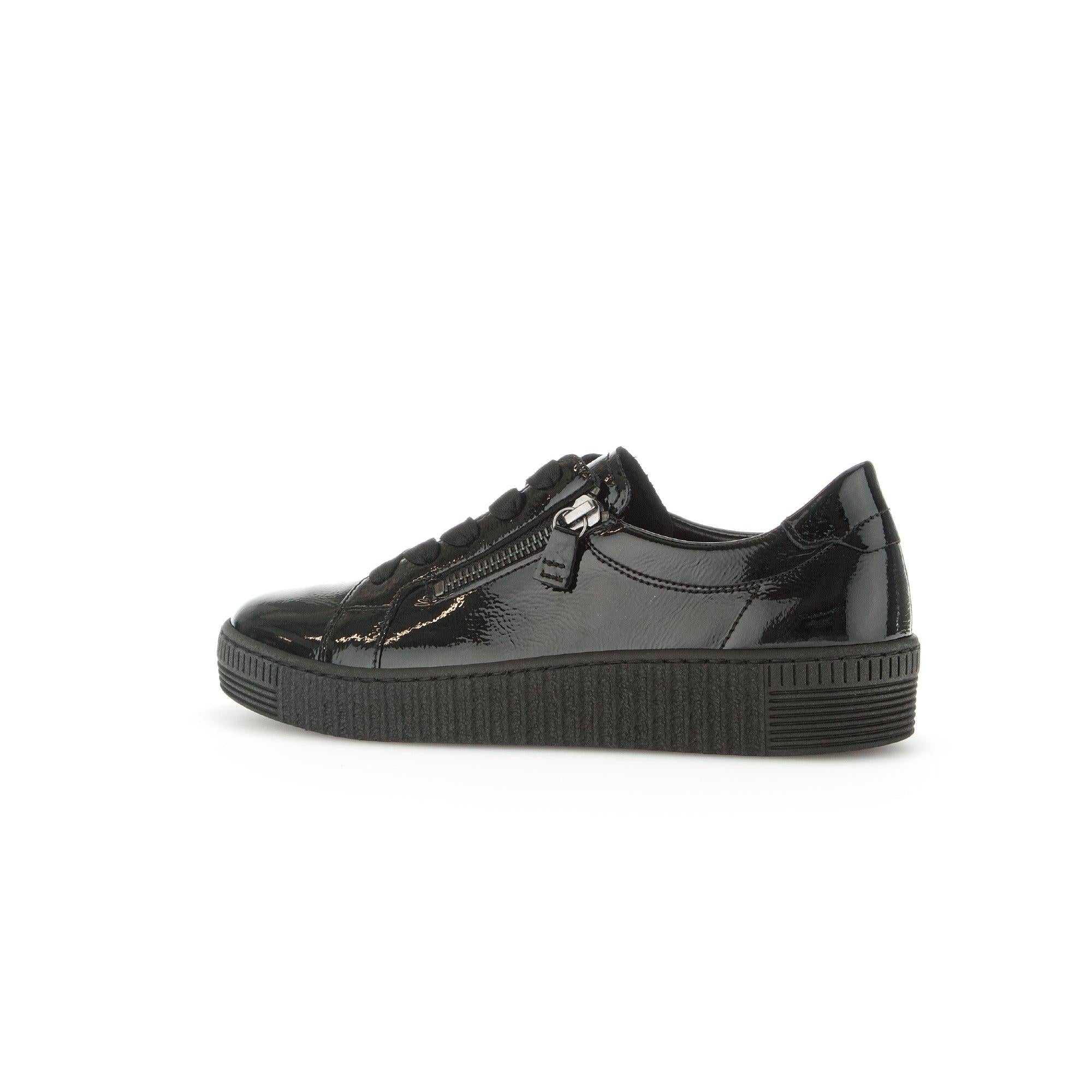 Gabor ladies' black patent leather trainers with zip and lace-up design, chunky sole, and sleek finish.