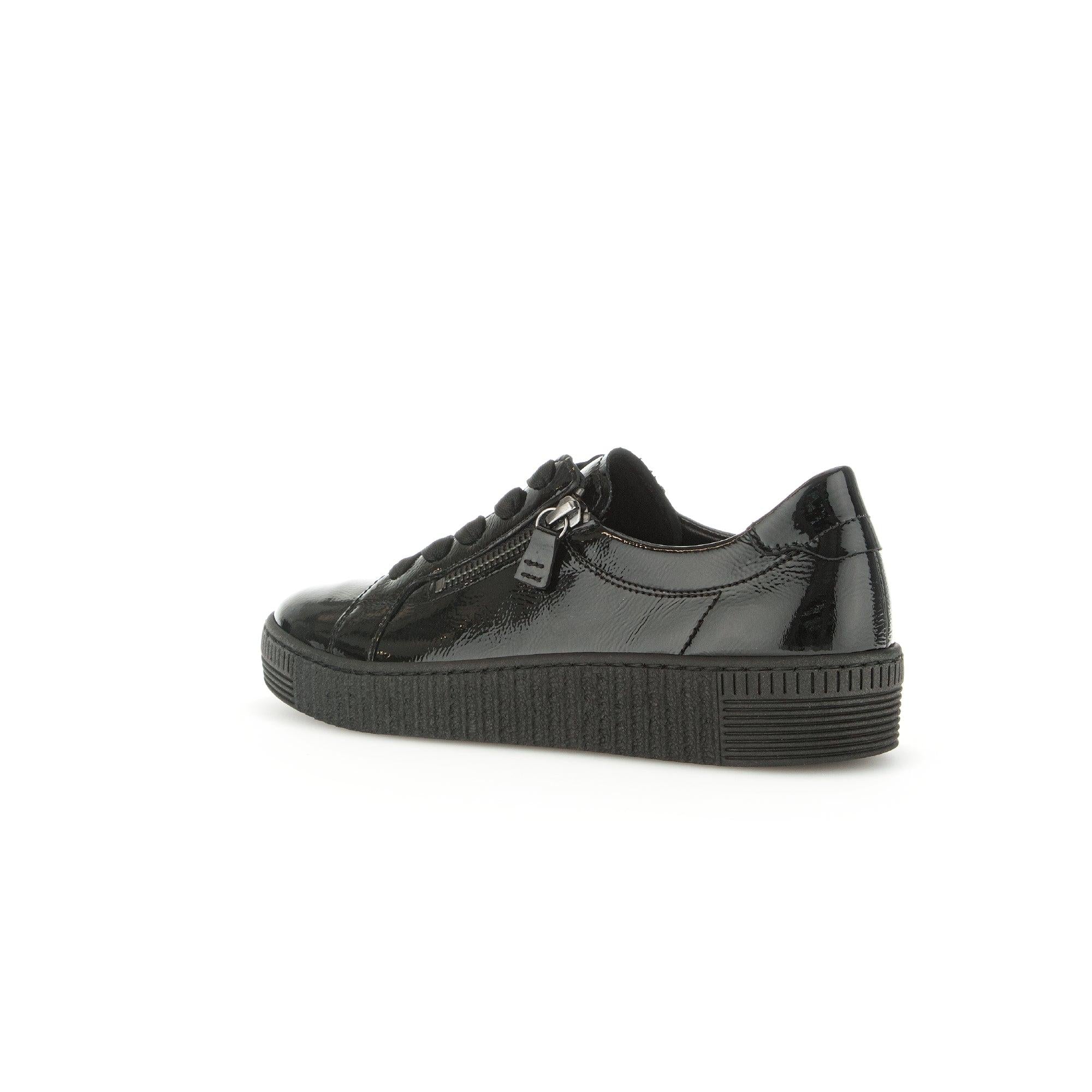 Gabor black patent leather women's trainers with zip and lace-up closure, chunky sole, and tonal stitching.