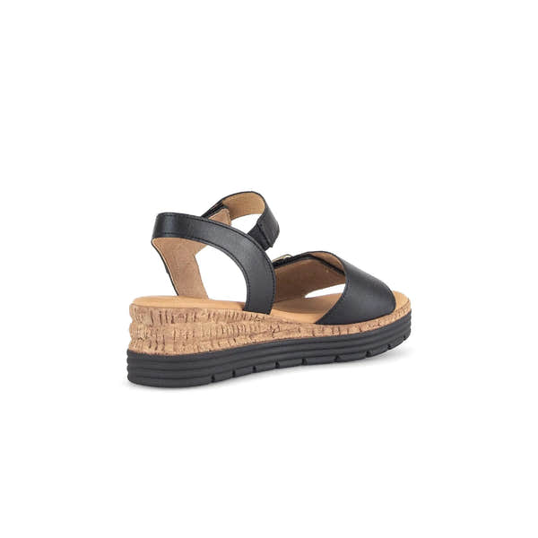 Black leather touch fastening sandals with a cork wedge and black rubber sole, featuring stylish cross-strap design.