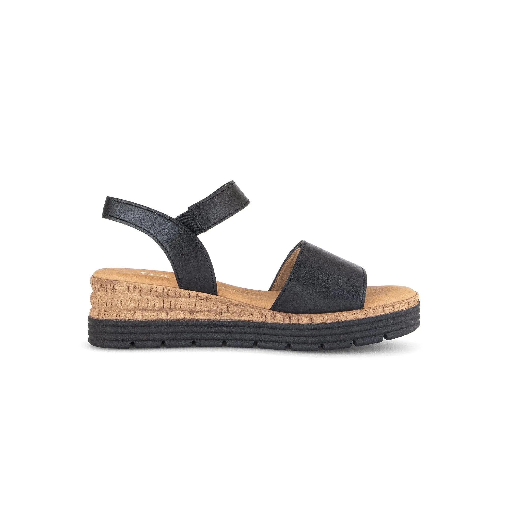 Black leather touch-fastening women's sandals with wedge cork sole and black rubber outsole.