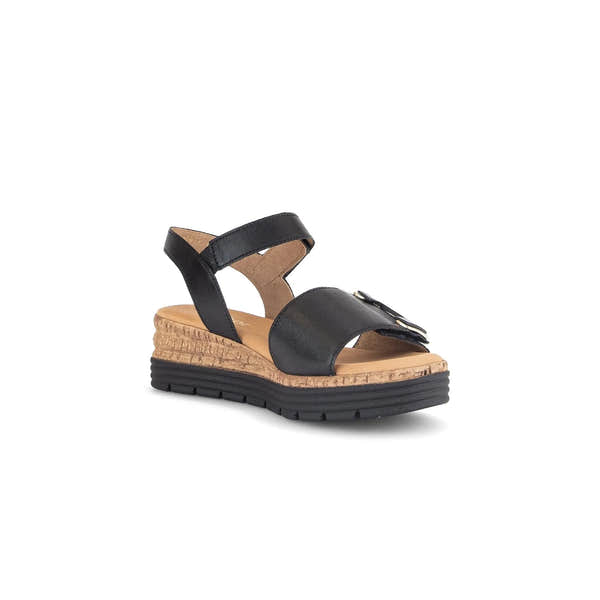 Black leather sandals with touch fastening, cork midsole, and rubber outsole for comfort and style.