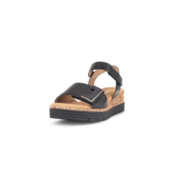 Black leather sandals with touch fastening, cork midsole, and subtle gold detail. Stylish and comfortable design.