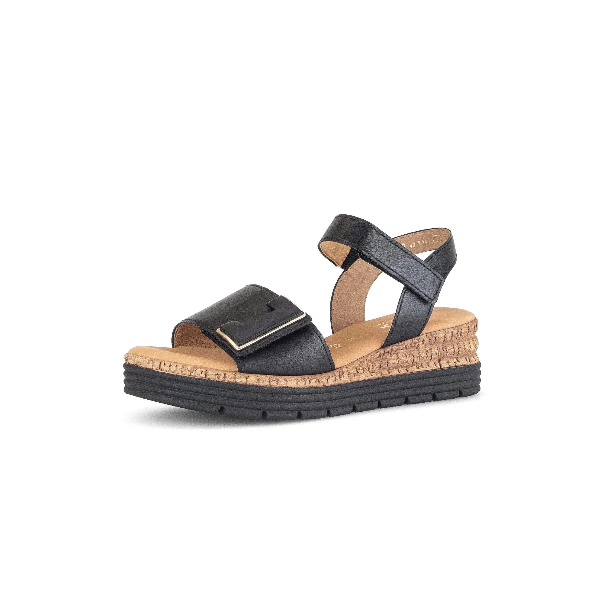 Black leather touch fastening sandal with cork wedge sole and a large buckle on the strap.
