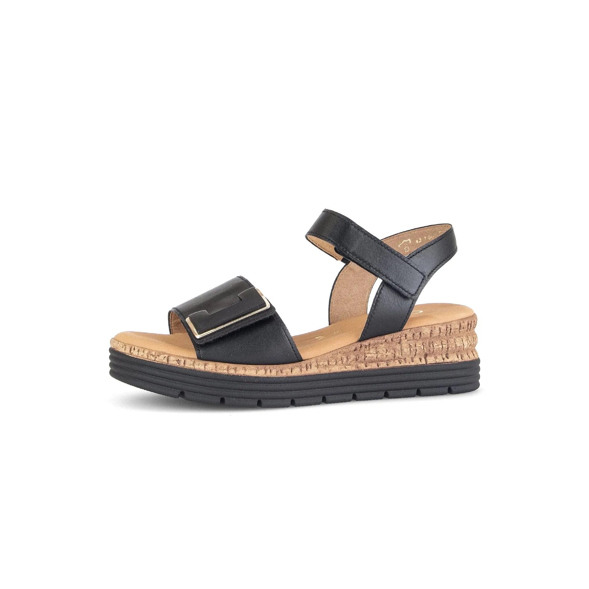Black leather touch-fastening women’s sandals with adjustable straps and cork-textured platform sole.