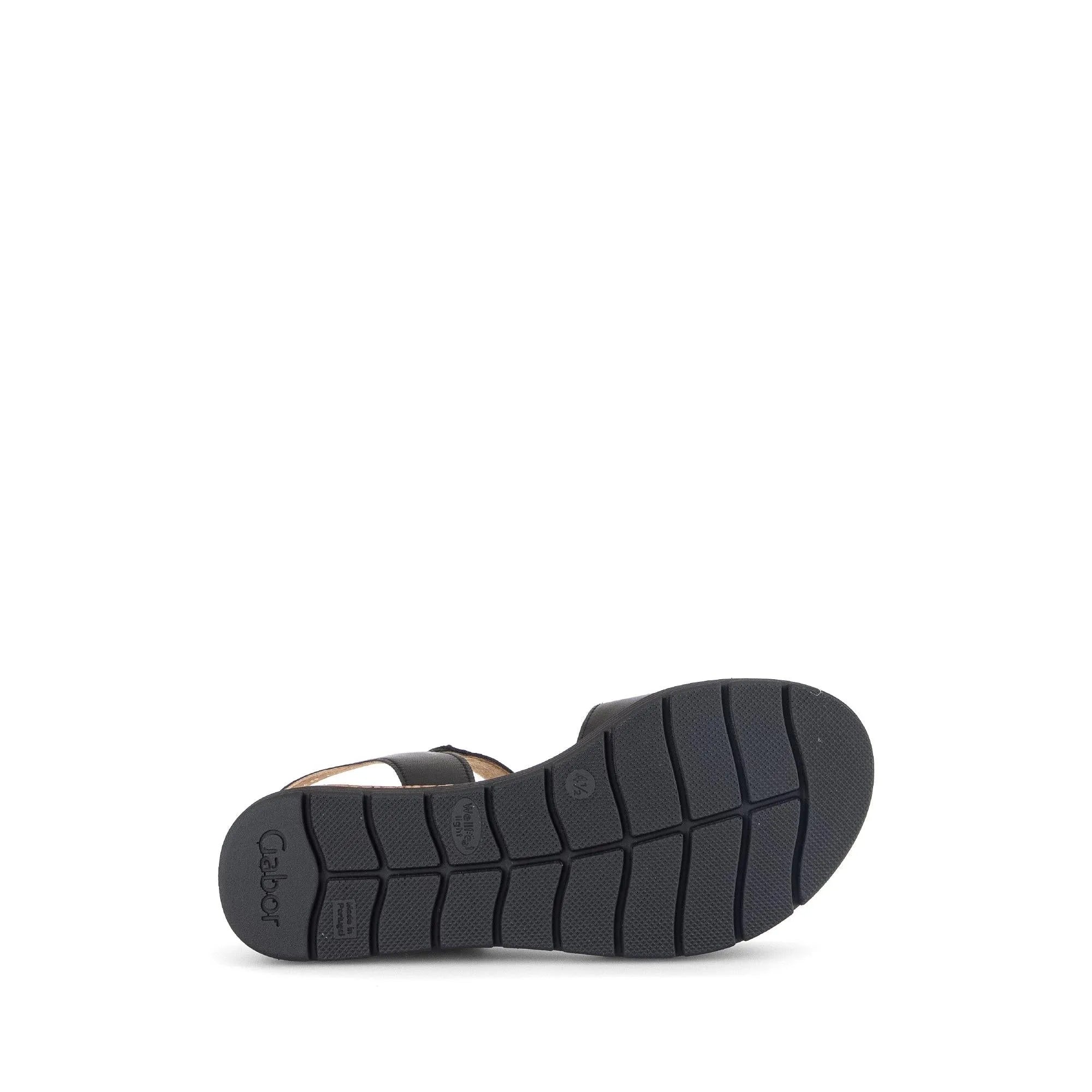 Black leather ladies' sandals with touch fastening and chunky sole, shown from below.