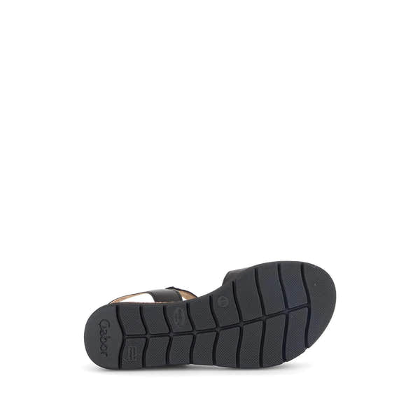 Black leather ladies' sandals with touch fastening and chunky sole, shown from below.