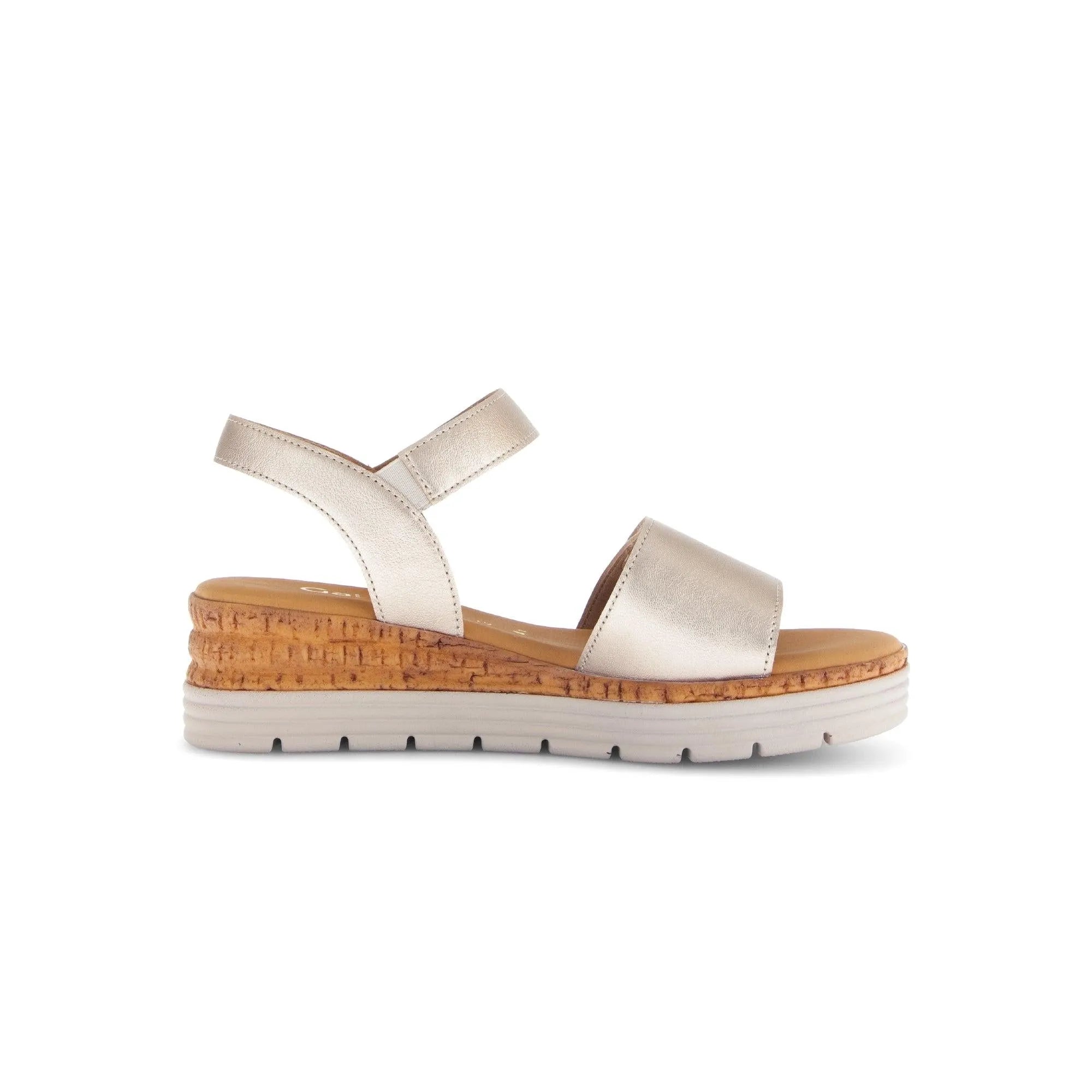 Beige leather touch fastening sandals with a cork-wedge heel and elasticated ankle strap, offering stylish comfort.