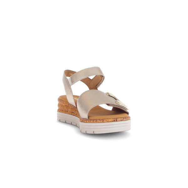 Beige leather touch fastening sandals with a textured wedge, elegant strap design, and decorative metallic detail.