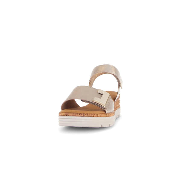 Beige leather touch fastening ladies' sandals with a chunky white sole and large decorative buckle.