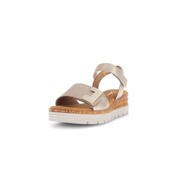 Beige leather touch fastening sandal with a thick platform wedge sole, gold-tone buckle, and cushioned insole.