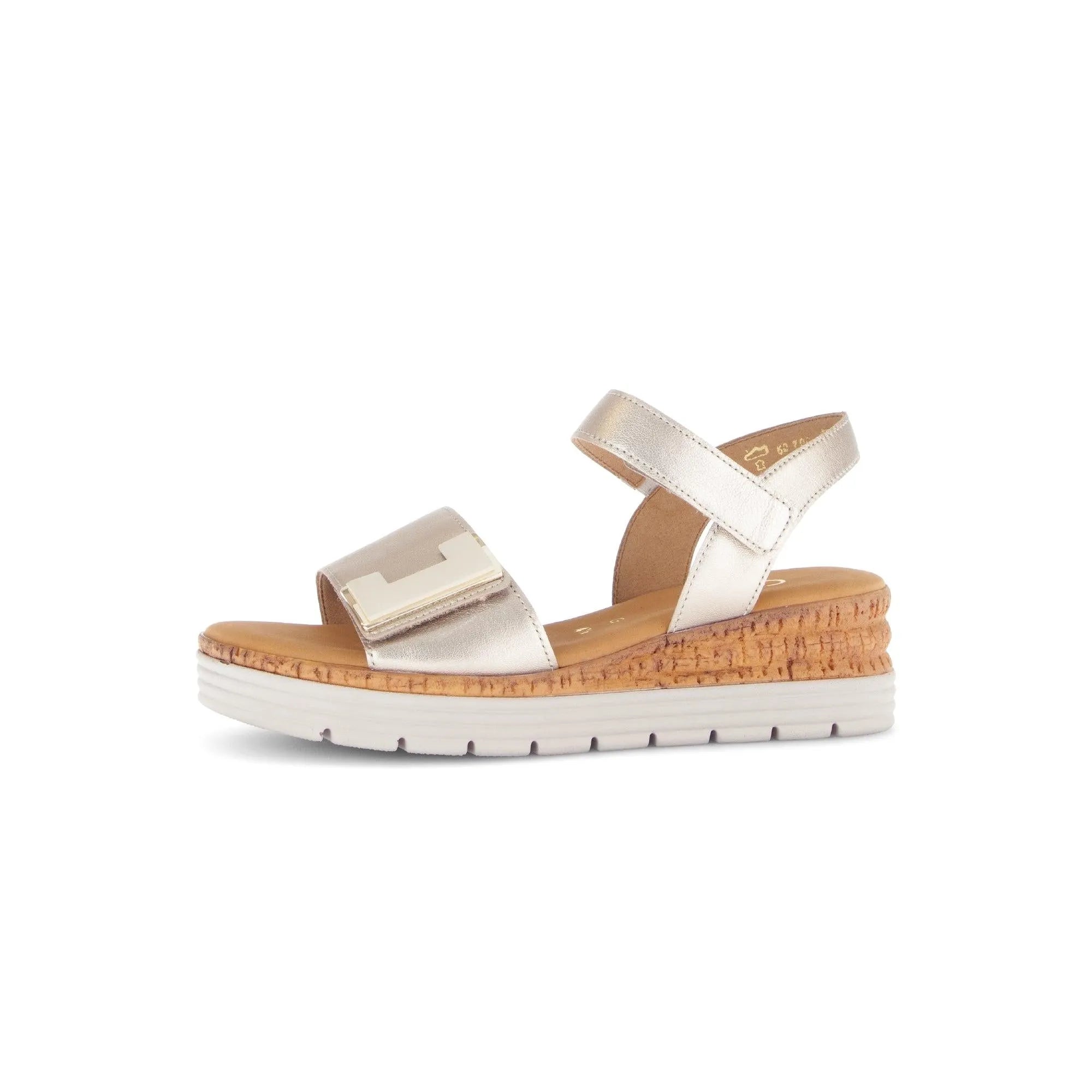 Beige leather touch fastening sandal with chunky cork and white sole, featuring a metallic strap and adjustable ankle strap.