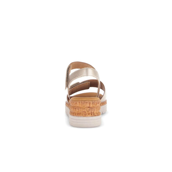 Beige leather sandals featuring touch fastening, open heel, and a stylish cork-effect midsole.