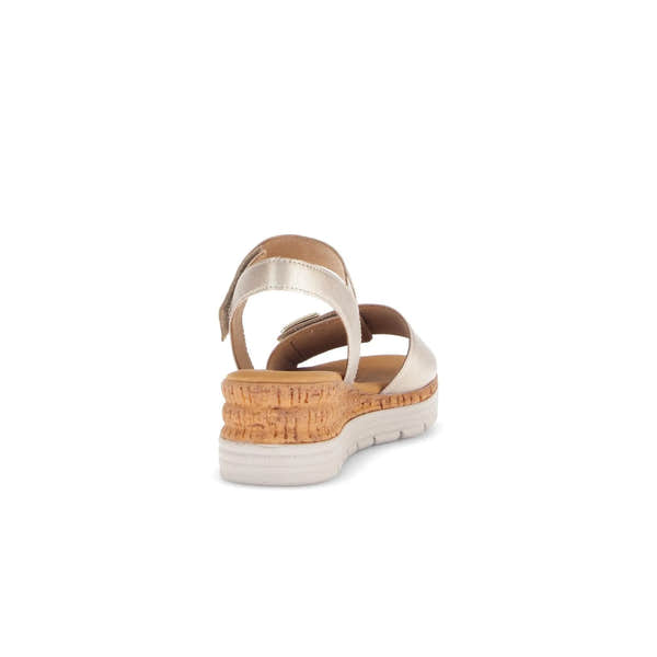 Beige leather touch fastening sandal with cork wedge heel, cushioned insole, and white rubber outsole.