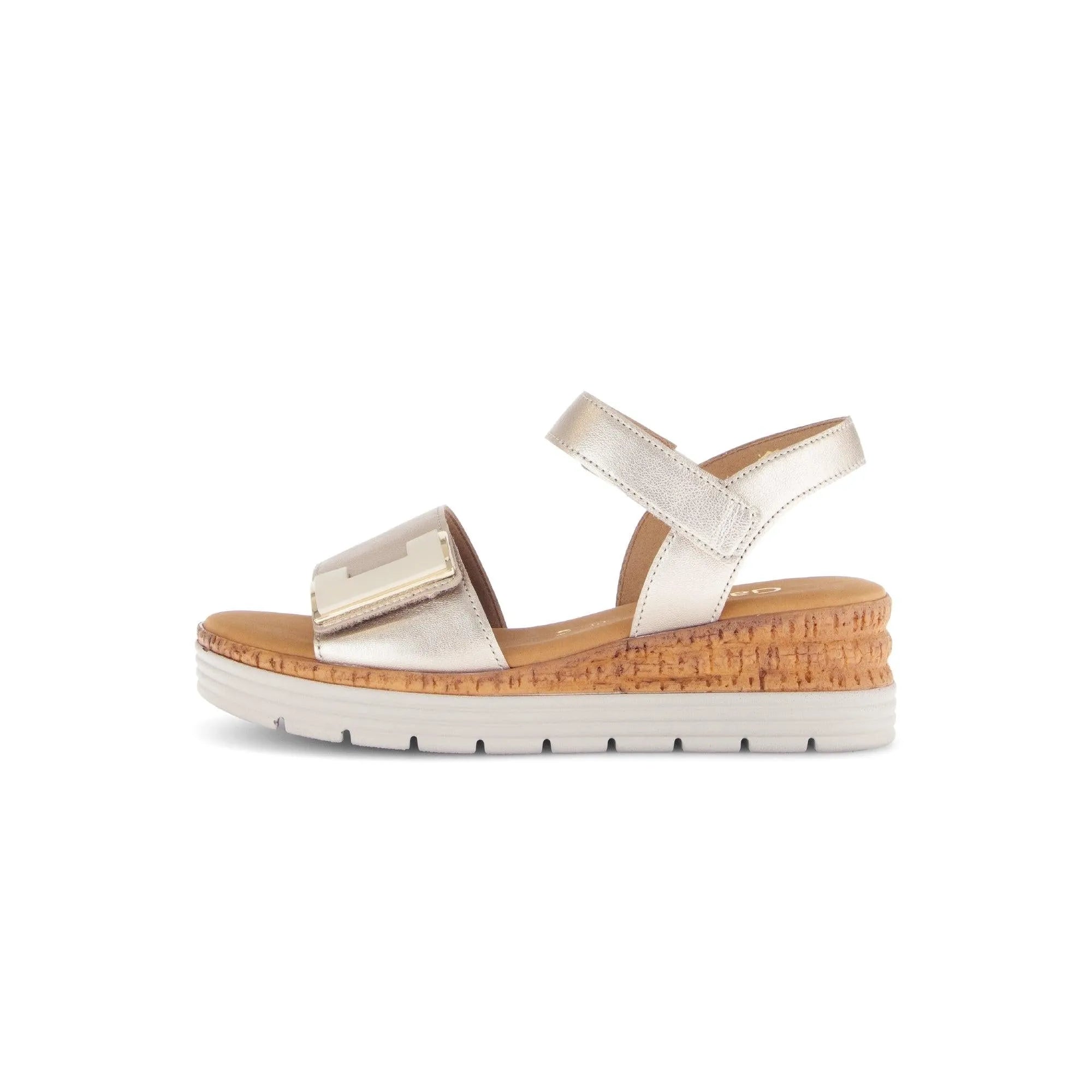 Beige leather sandals with touch fastening, metallic accents, and a cork wedge sole for comfort and style.