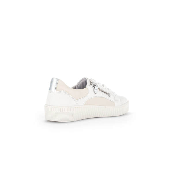 White leather and beige fabric lace-up trainers with silver zip detail and chunky rubber sole.