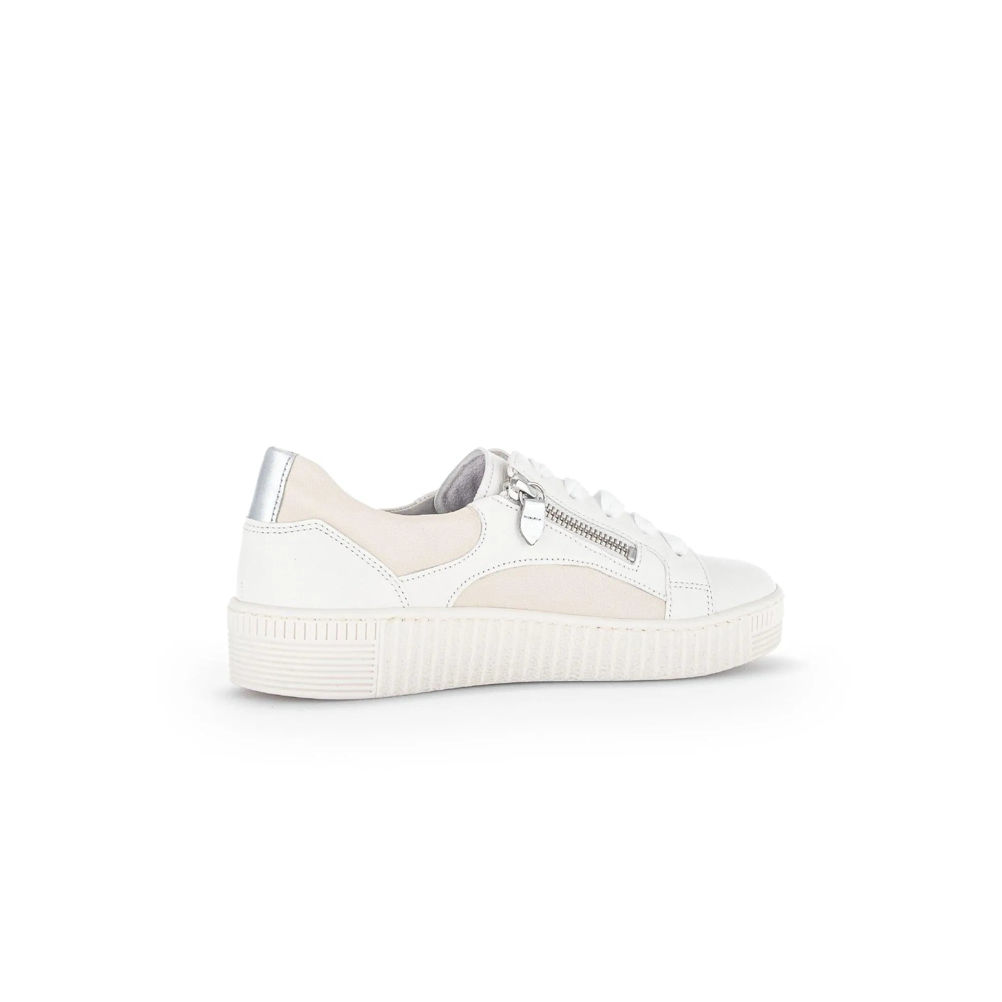 White leather trainer with beige accents, silver zip detail, lace-up, and chunky sole.