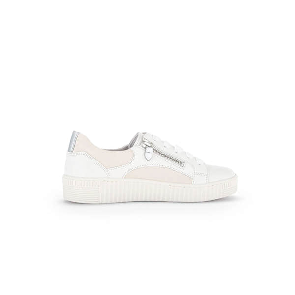 White and beige leather women's trainer with lace-up front, side zipper, and chunky rubber sole.
