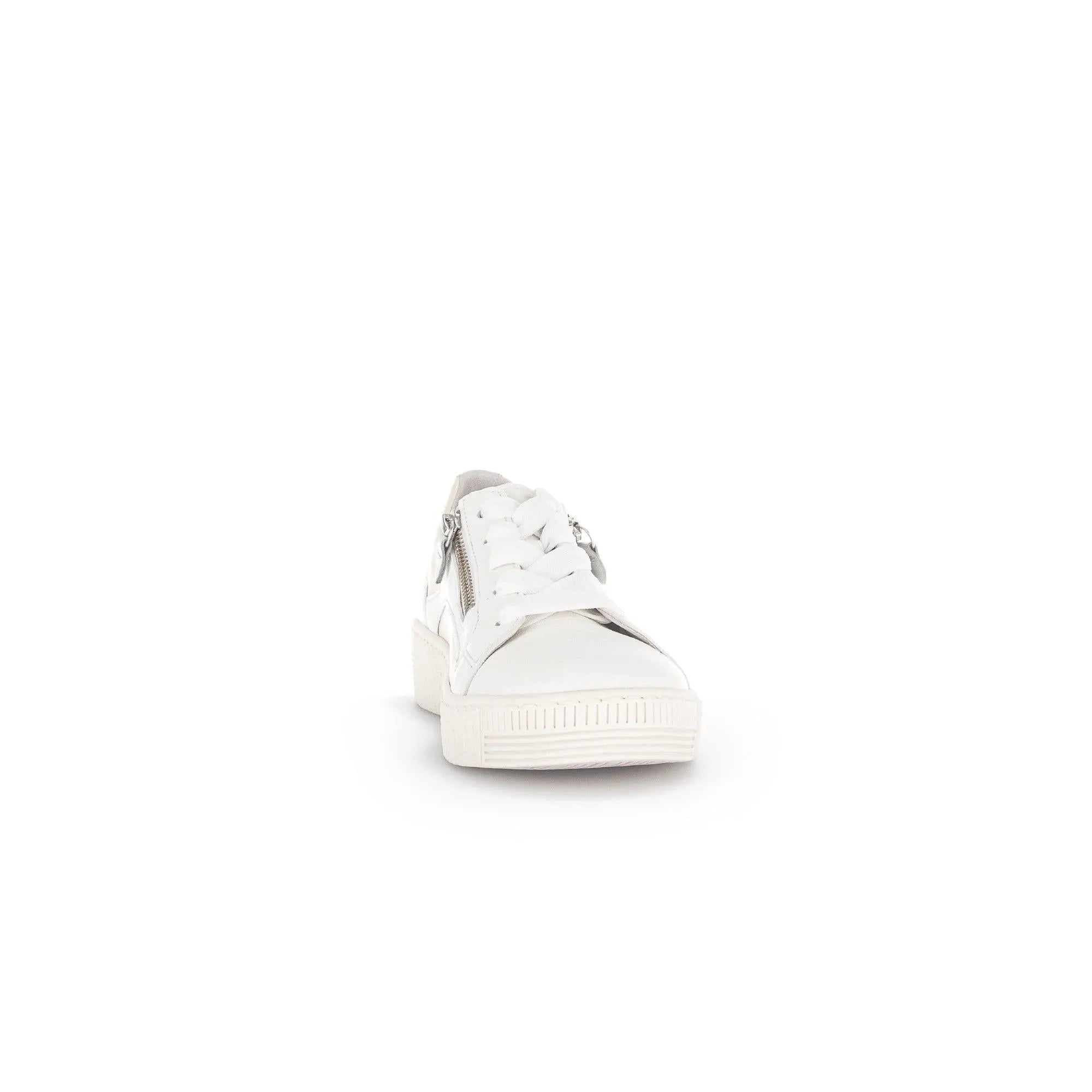 White leather women's trainer with lace-up front, silver zipper detail, padded heel, and chunky rubber sole.