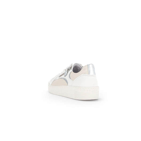 White and latte leather trainers with zip and lace detailing, featuring a silver heel accent and textured sole.