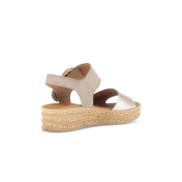 Beige leather women's platform sandal with touch fastenings, chunky sole, and metallic accents.