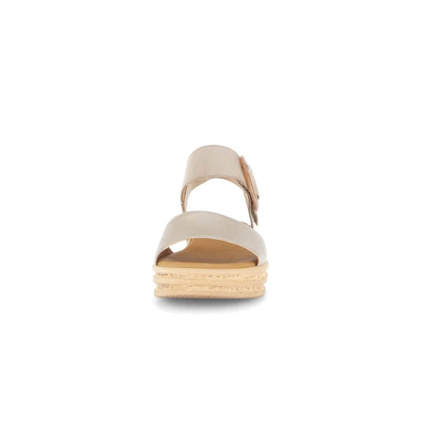 Beige leather touch fastening ladies' sandals, open-toe design with a layered sole, side buckles, and decorative bows.