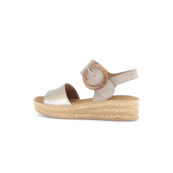 Beige leather touch fastening sandal with a wide strap, round buckle, and thick layered sole.