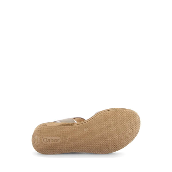 Beige leather sandals with touch fastening, featuring a textured sole and minimalist design for comfort and style.
