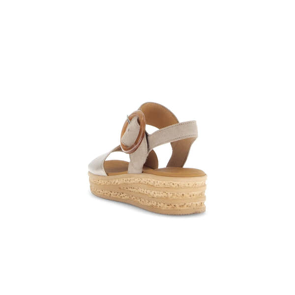 Beige leather touch fastening sandals with a stylish ankle strap and thick, textured wedge sole for comfort.