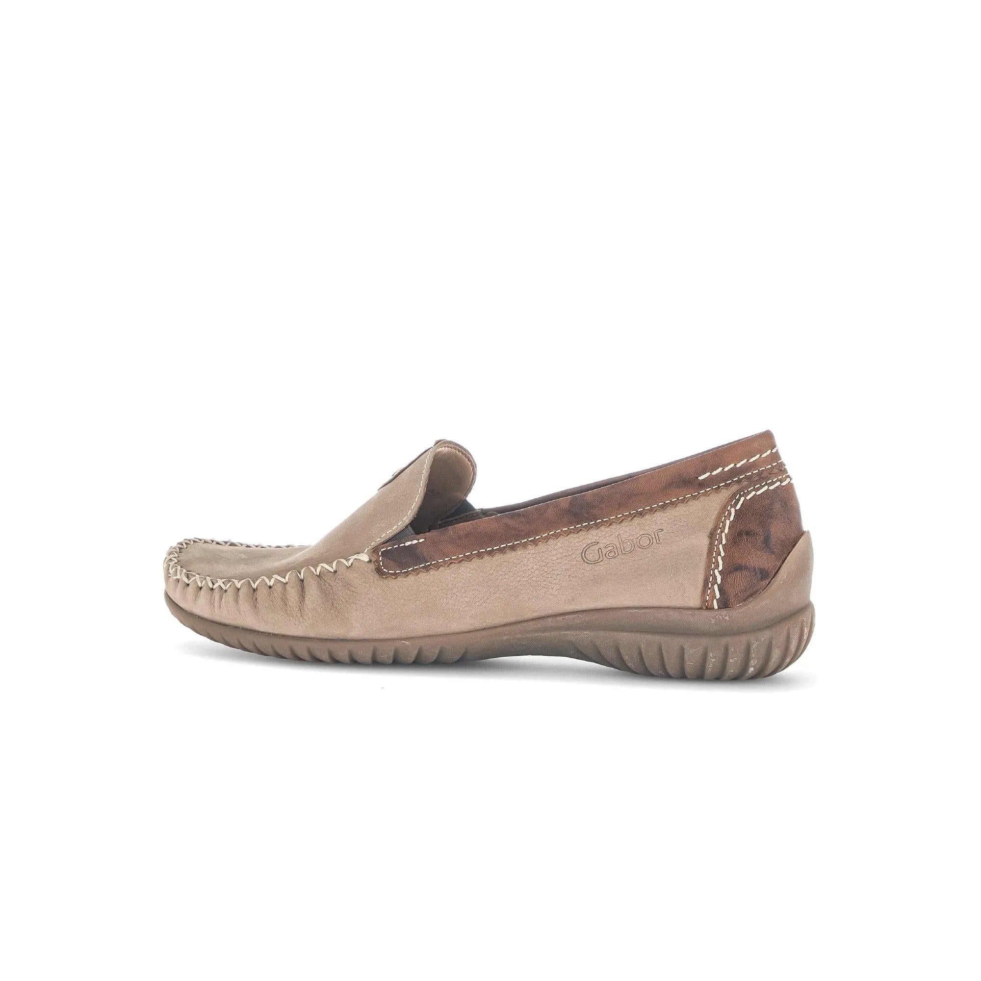 Beige nubuck slip-on shoes featuring a brown leather accent and decorative stitching, designed for casual comfort.