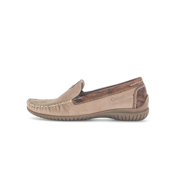 Beige nubuck slip-on shoes with decorative stitching and brown leather accents, featuring a flexible sole for comfort.