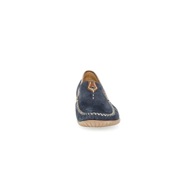 Blue nubuck slip-on shoe with tan accents, decorative stitching, and a flexible beige rubber sole.