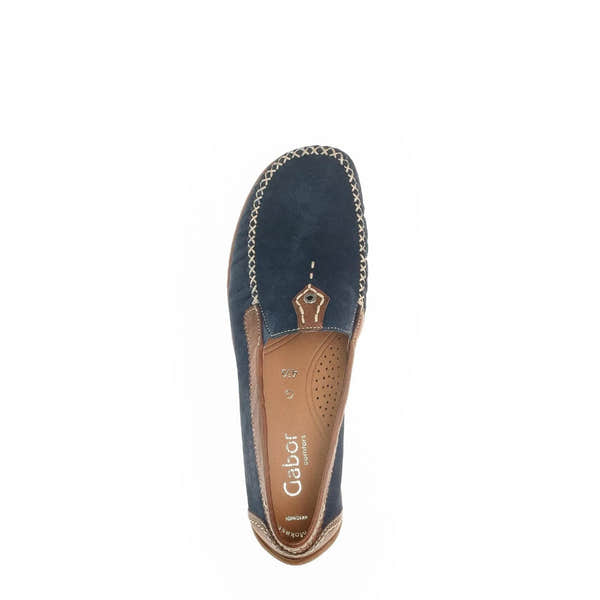 Blue nubuck slip-on shoe with tan leather accents, stitched detailing, and a cushioned interior; casual, comfortable style.