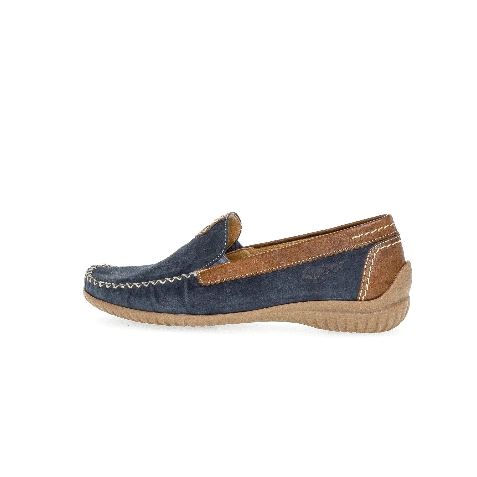 Blue nubuck slip-on shoes with brown leather accents and decorative stitching, featuring a soft outsole for comfort.