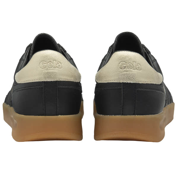 Gola Stadia Leather Ladies black, gold, and gum lace-up trainers, crafted with leather, featuring a stylish design and rubber sole.