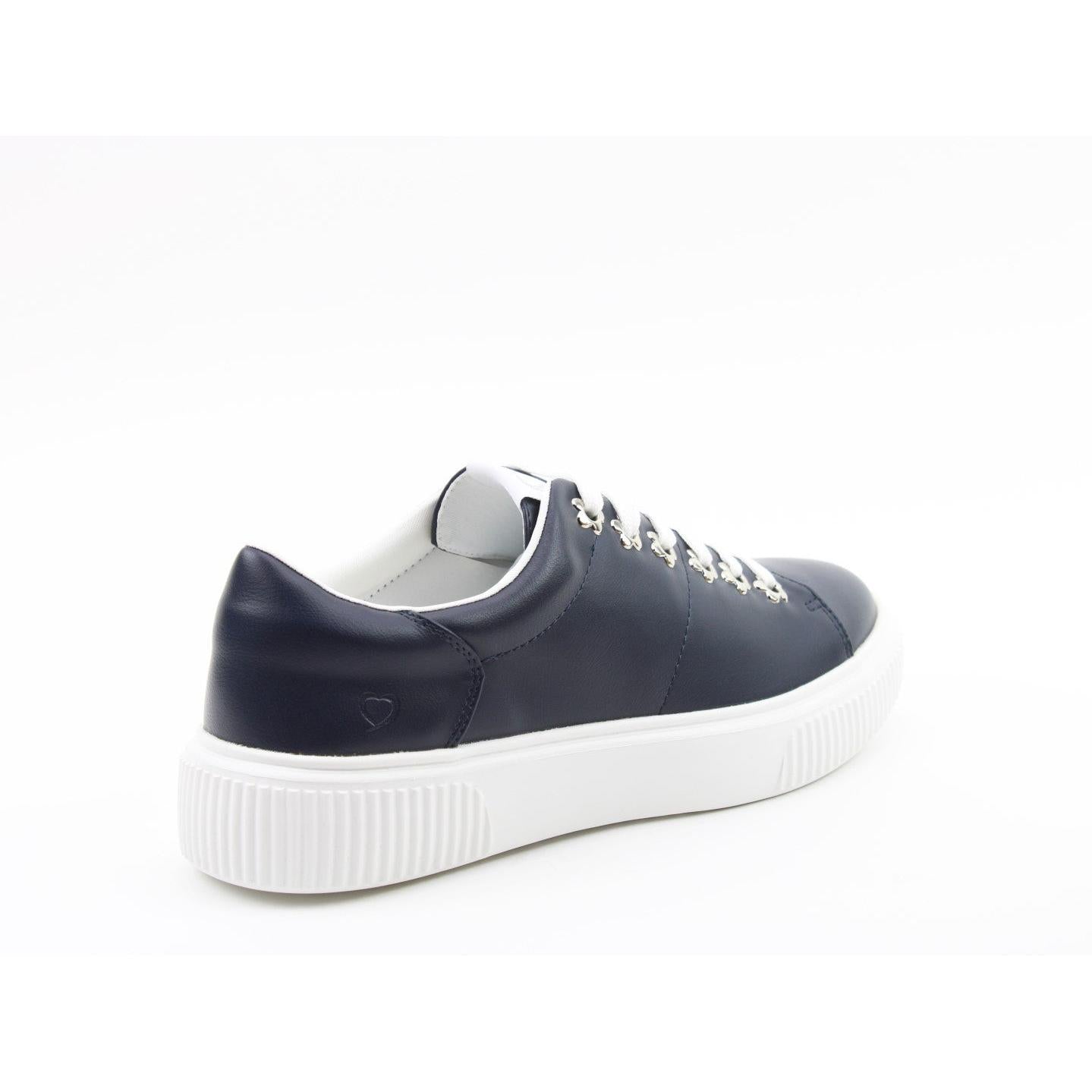 Heavenly Feet Feather Ladies Navy Vegan Slip-On Trainers with white sole and heart logo detail.
