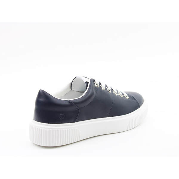 Heavenly Feet Feather Ladies Navy Vegan Slip-On Trainers with white sole and heart logo detail.