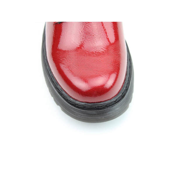 Red patent vegan ankle boot with zip and lace details, heeled sole, and shiny finish.