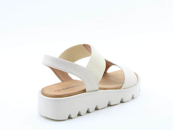 Heavenly Feet Ritz beige vegan pull-on sandals with a chunky white platform sole and elastic straps, stylish for summer wear.