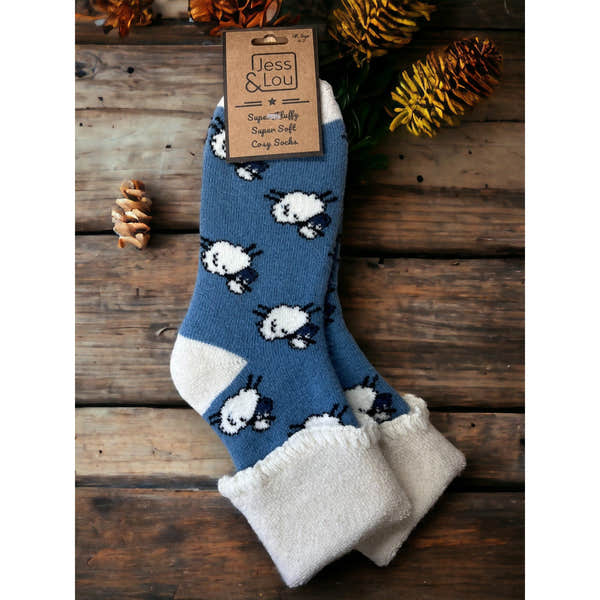 Jess & Lou cornflower blue cozy cuffed socks with white sheep pattern, super soft and comfortable for women.