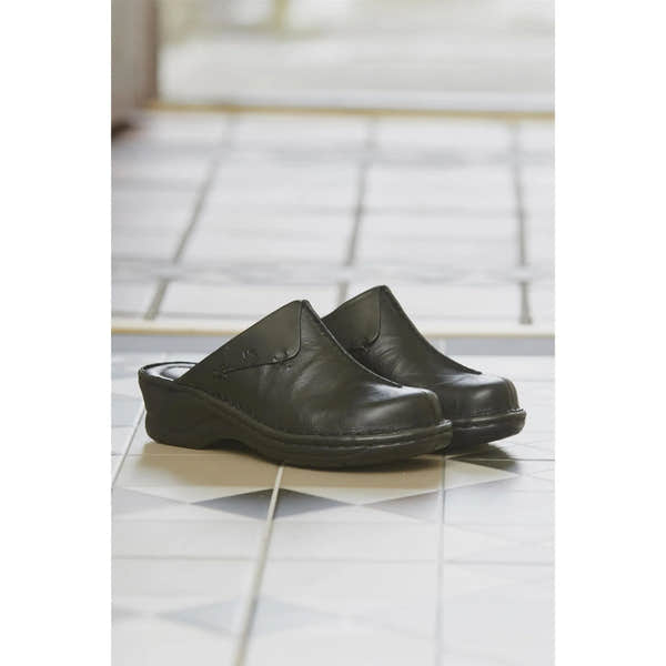 Josef Seibel Catalonia 48 black ladies' leather mules, slip-on comfort shoes with a low heel, on tiled floor.