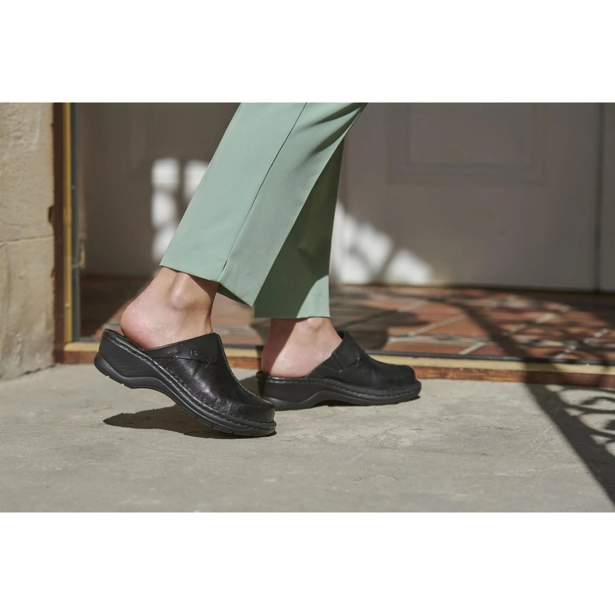Josef Seibel Catalonia 48 Black women's leather slip-on mules, comfortable footwear for ladies, stylish and versatile design.