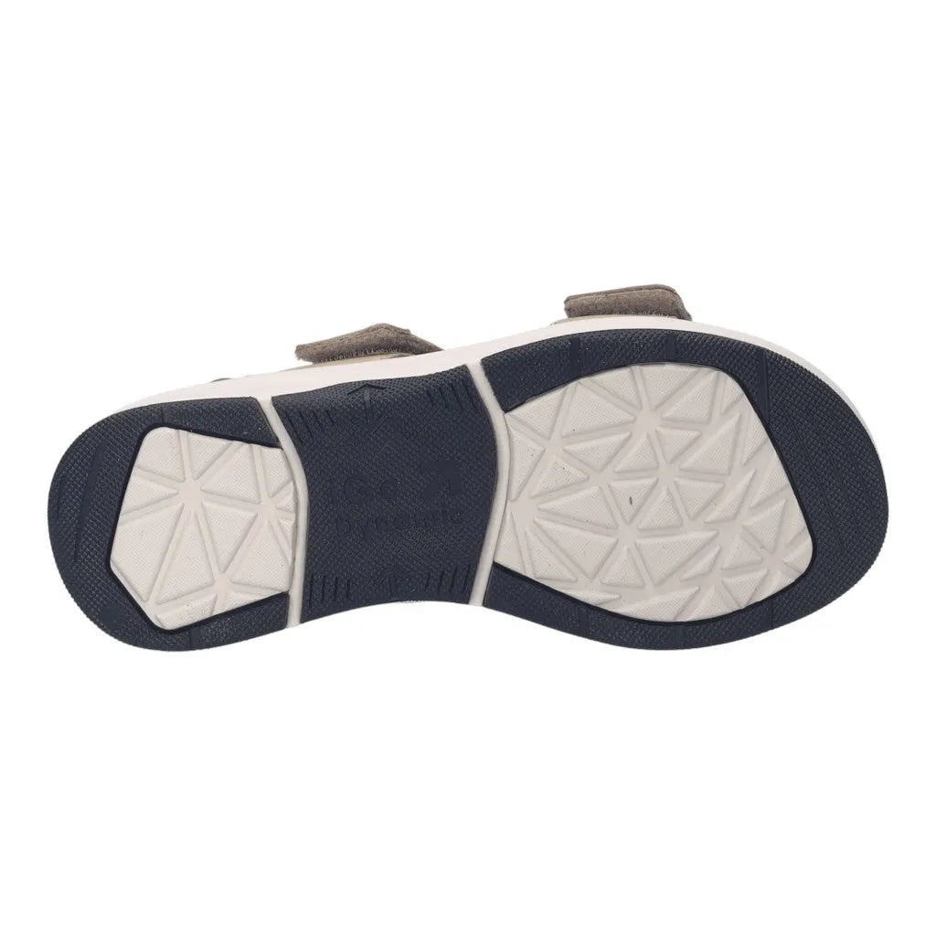 Beige leather sandal with touch fastenings, black and white textured sole, and cushioned design for comfort.