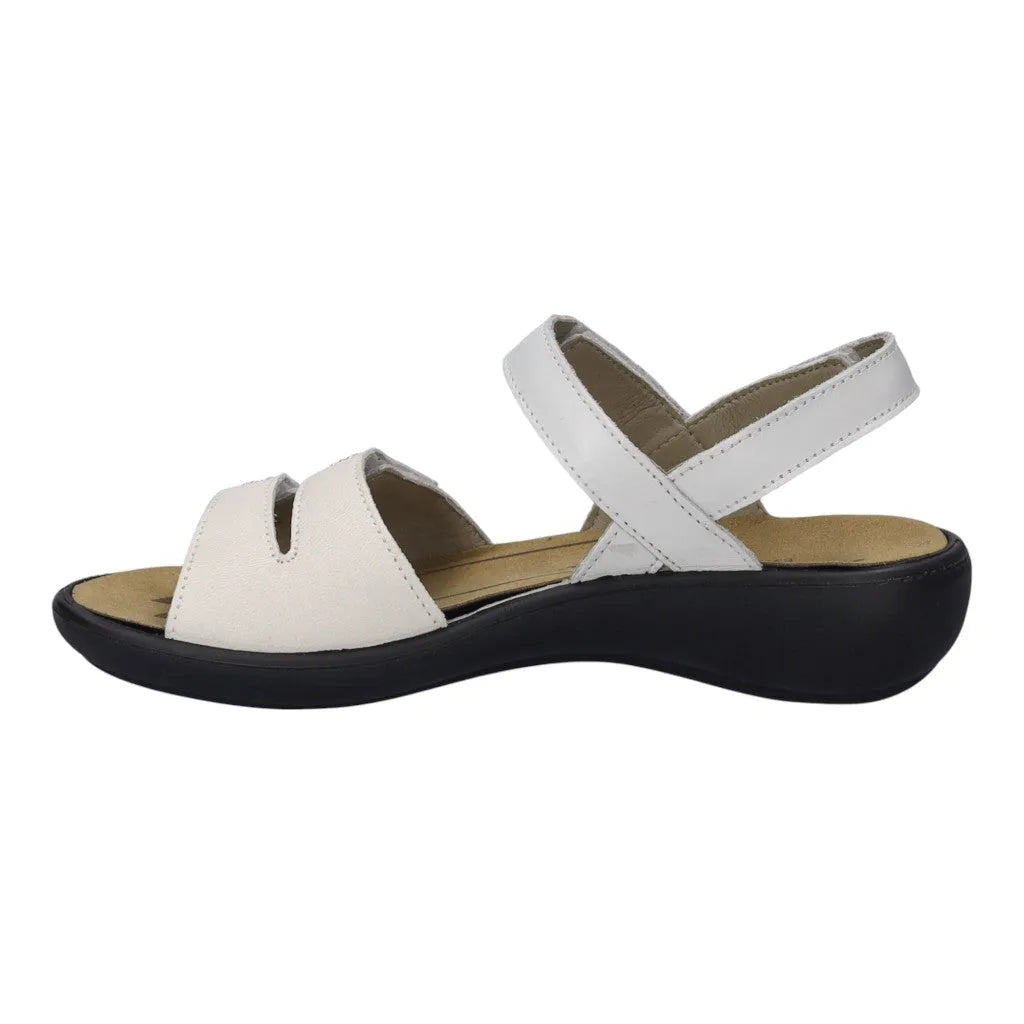White leather touch fastening sandals with a cross strap design and cushioned insole, featuring a low black wedge heel.